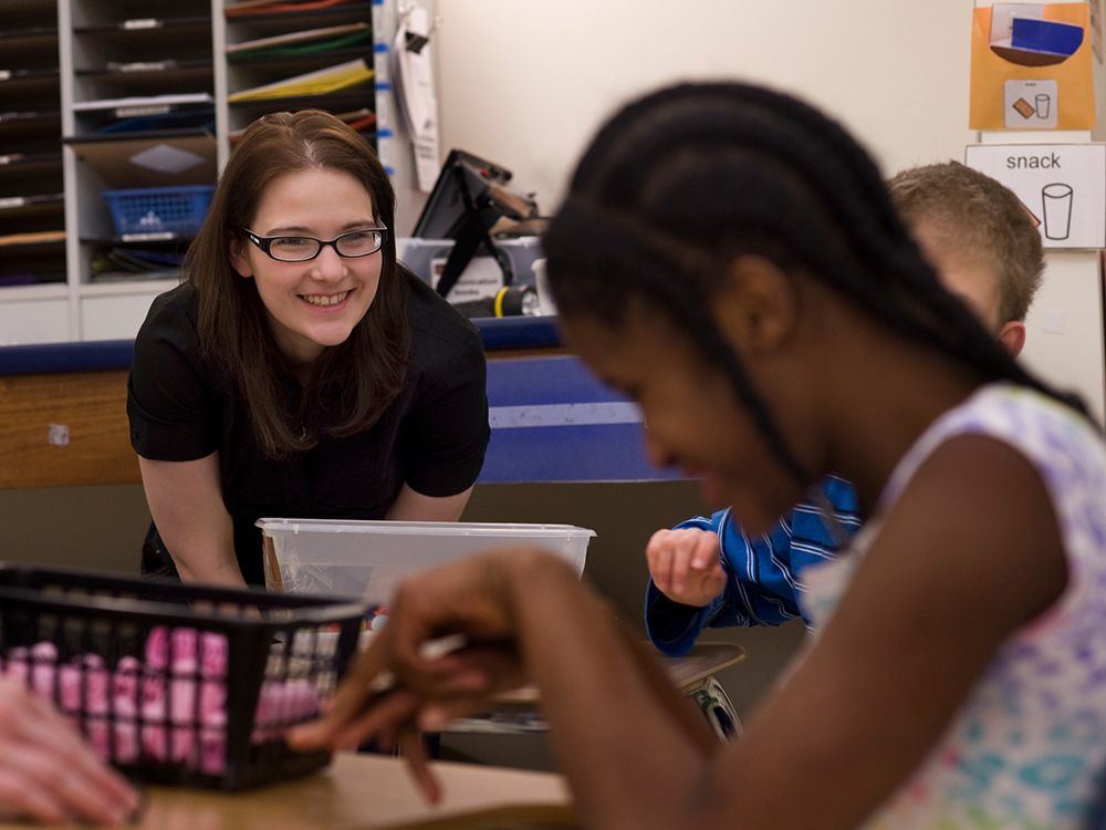 Pictured is a Point Park education student with a special education student at The Watson Institute. | Photo by Martha Rial